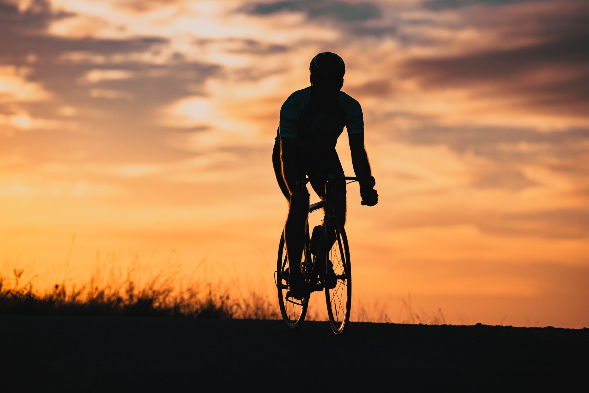 cyclist silhouette at sunset sports and fitness co 2023 11 27 04 51 01 utc
