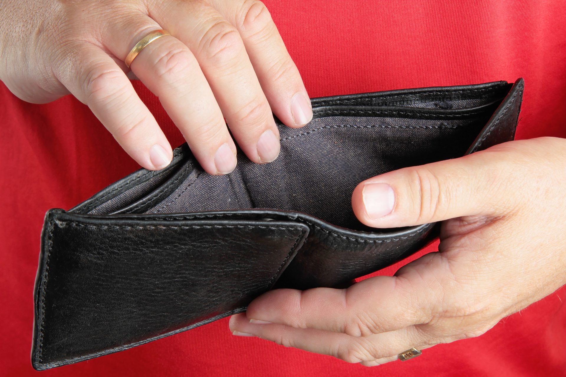 man holding empty wallet deception poverty debt 2023 11 27 05 14 09 utc