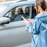woman controlling car through the smartphone 2023 11 27 05 16 54 utc