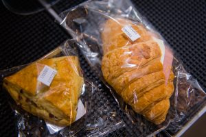 closeup of fresh pastry in plastic bags on a table 2023 11 27 04 50 09 utc
