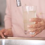 dirty water pouring from a faucet tap in a glass 2023 11 27 05 15 45 utc