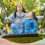 happy latin mother playing with her son looking up 2023 11 27 05 15 42 utc
