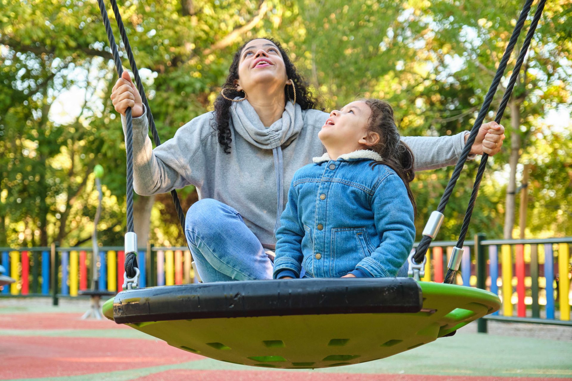 happy latin mother playing with her son looking up 2023 11 27 05 15 42 utc