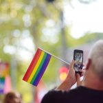 man activist with rainbow flag taking a picture us 2023 11 27 05 00 41 utc