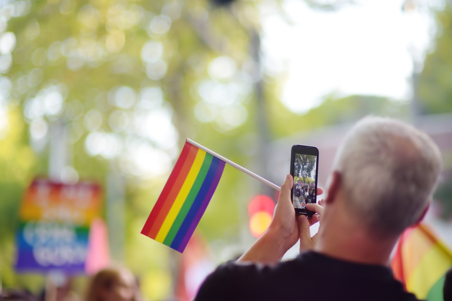 man activist with rainbow flag taking a picture us 2023 11 27 05 00 41 utc