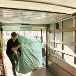 removals business a man lifting an item of furnit 2023 11 27 05 10 44 utc