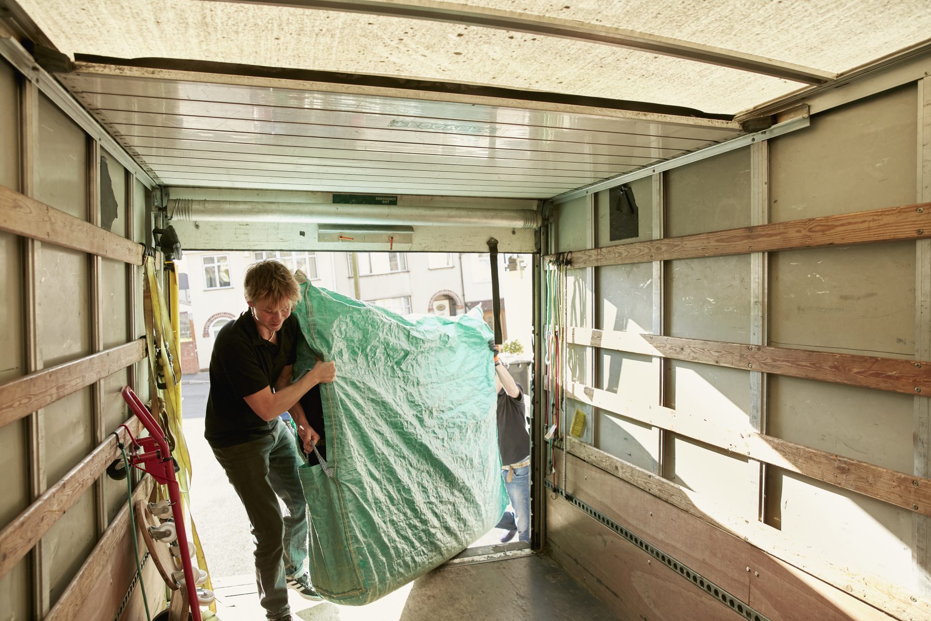 removals business a man lifting an item of furnit 2023 11 27 05 10 44 utc