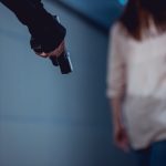 selective focus of robber holding gun near woman 2023 11 27 05 29