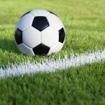 soccer ball on grass field with stripe 2023 11 27 05 34 44 utc