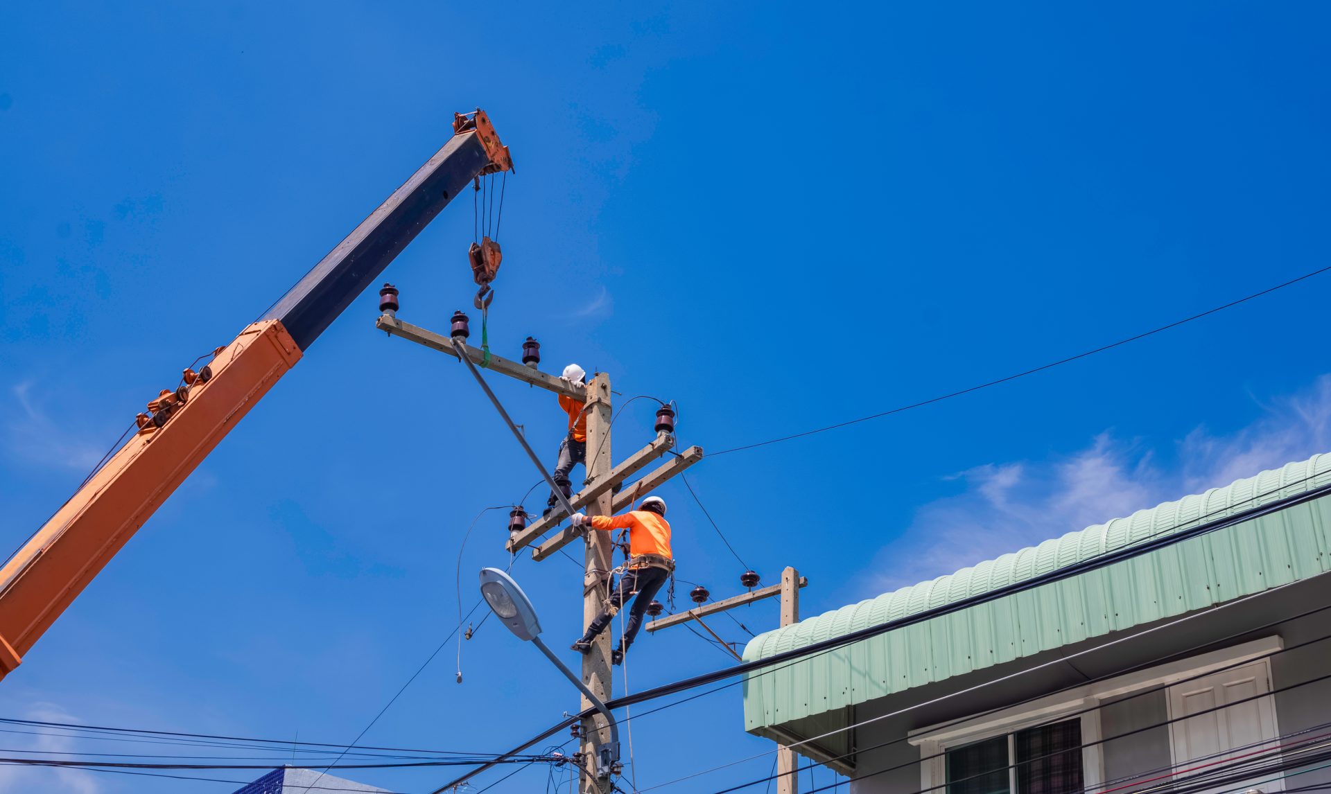 two electricians with crane truck are installing e 2023 11 27 04 53 45 utc