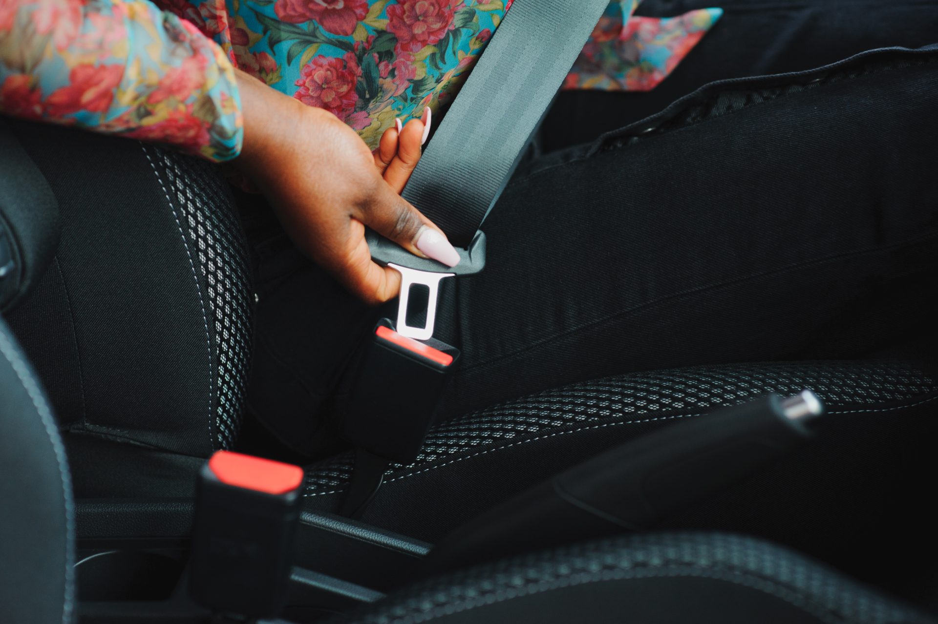 african woman hand buckling safety belt in the car 2023 11 27 05 13 58 utc