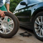 car breakdown man puts the spare tire 2023 11 27 05 32 46 utc