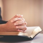 focus on woman s hand while praying for christiani 2023 11 27 05 33 46 utc