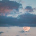 full moon rising in cloudy evening sky full moon 2023 11 27 04 58 55 utc
