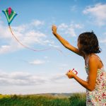 girl playing with kite in field 2023 11 27 05 11 32 utc
