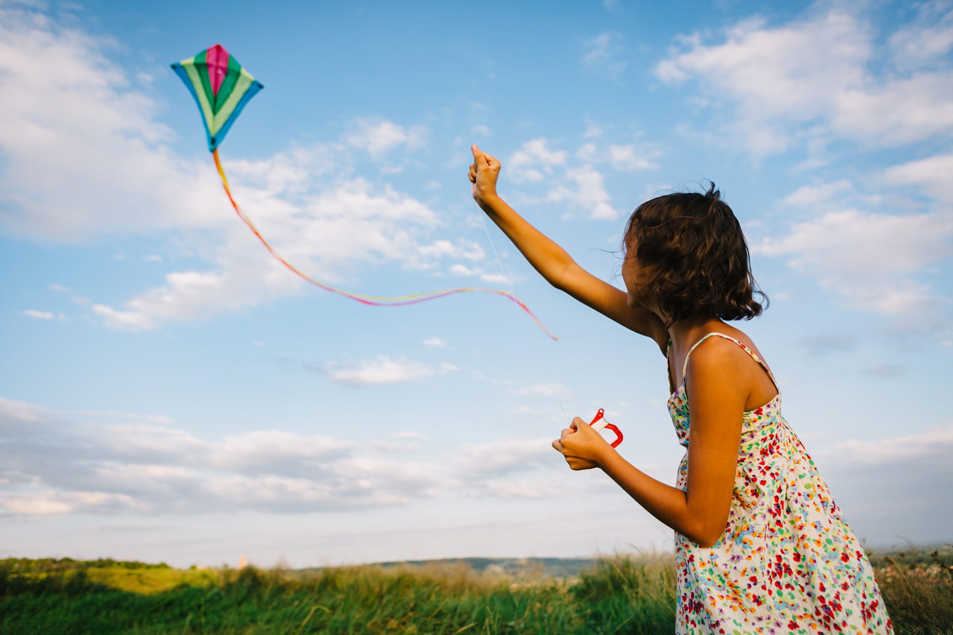 girl playing with kite in field 2023 11 27 05 11 32 utc
