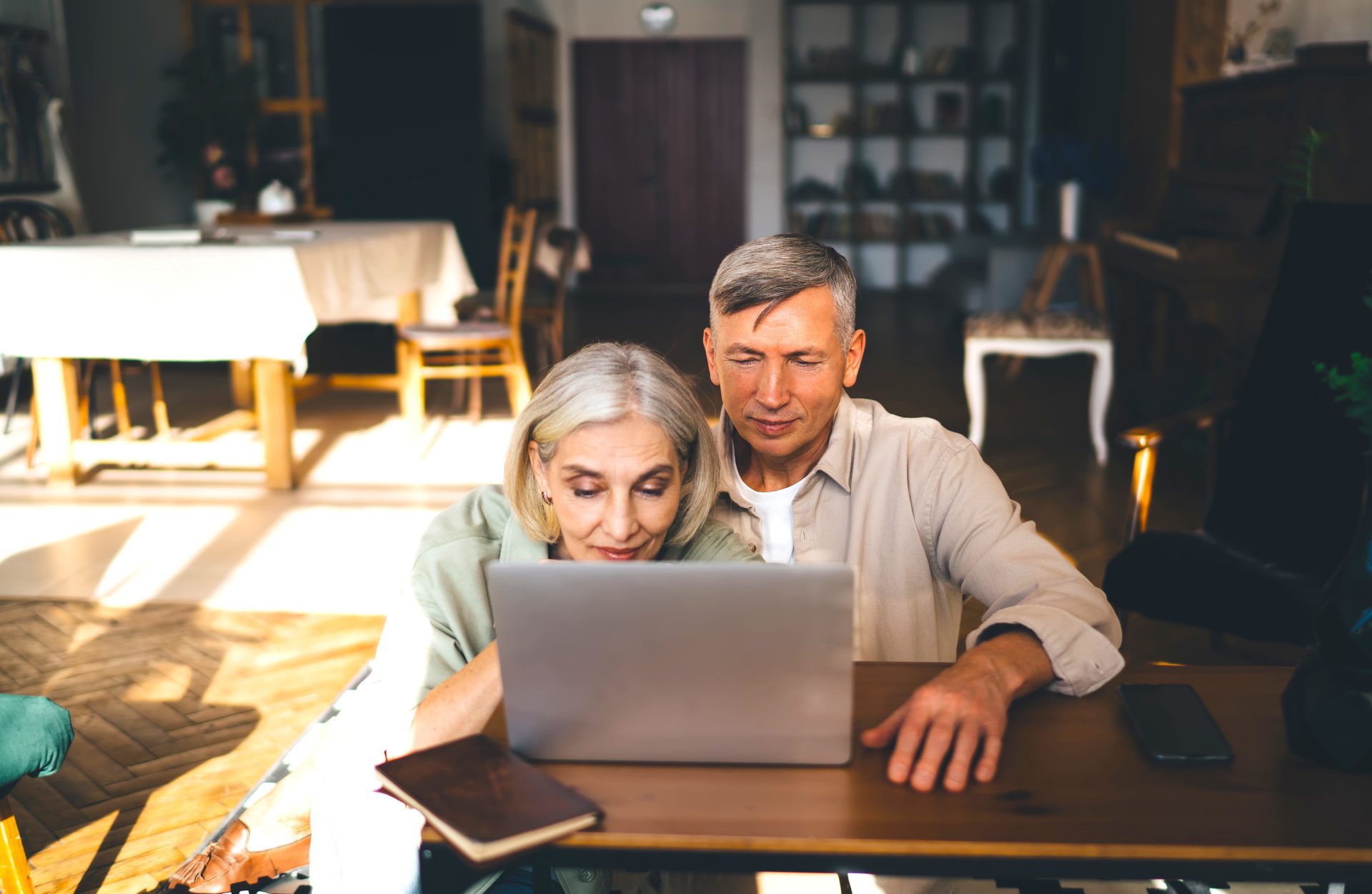 happy elderly couple using laptop in modern apartm 2024 01 26 18 39 51 utc