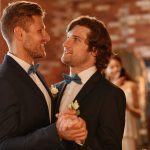 loving gay couple dancing in wedding side view 2023 11 27 05 17 57 utc