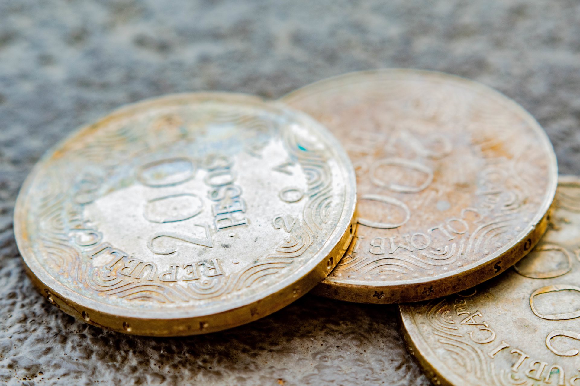 macro of three two hundred colombian peso coins 2023 11 27 05 19 14 utc