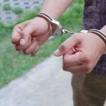 man in handcuffs on outdoor background 2023 11 27 05 20 33 utc