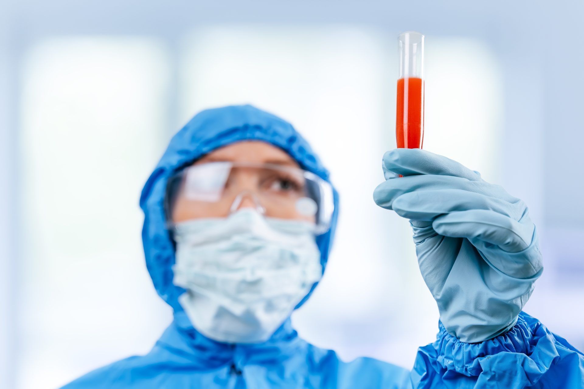 medic in hazmat protective suit holds a test tube 2023 11 27 04 59 09 utc