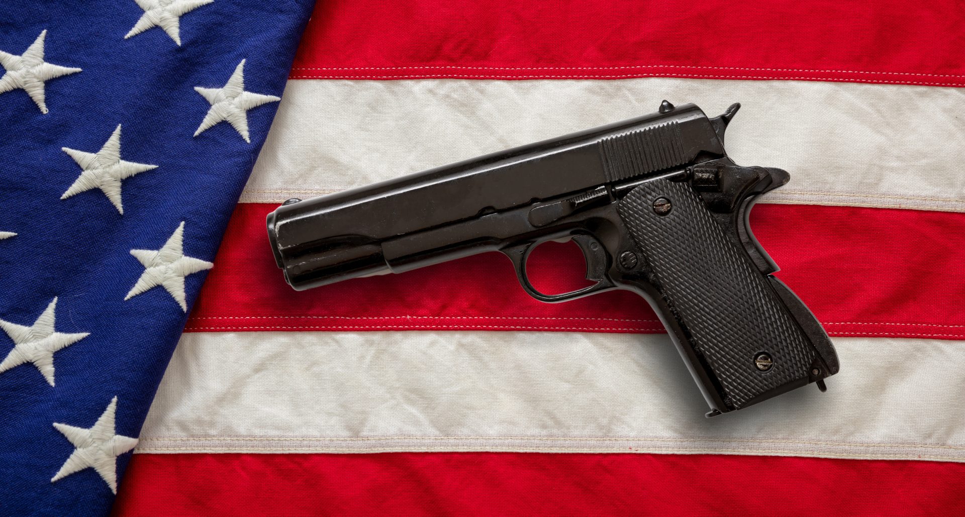 pistol on us america flag background top view gu 2023 11 27 04 54 33 utc