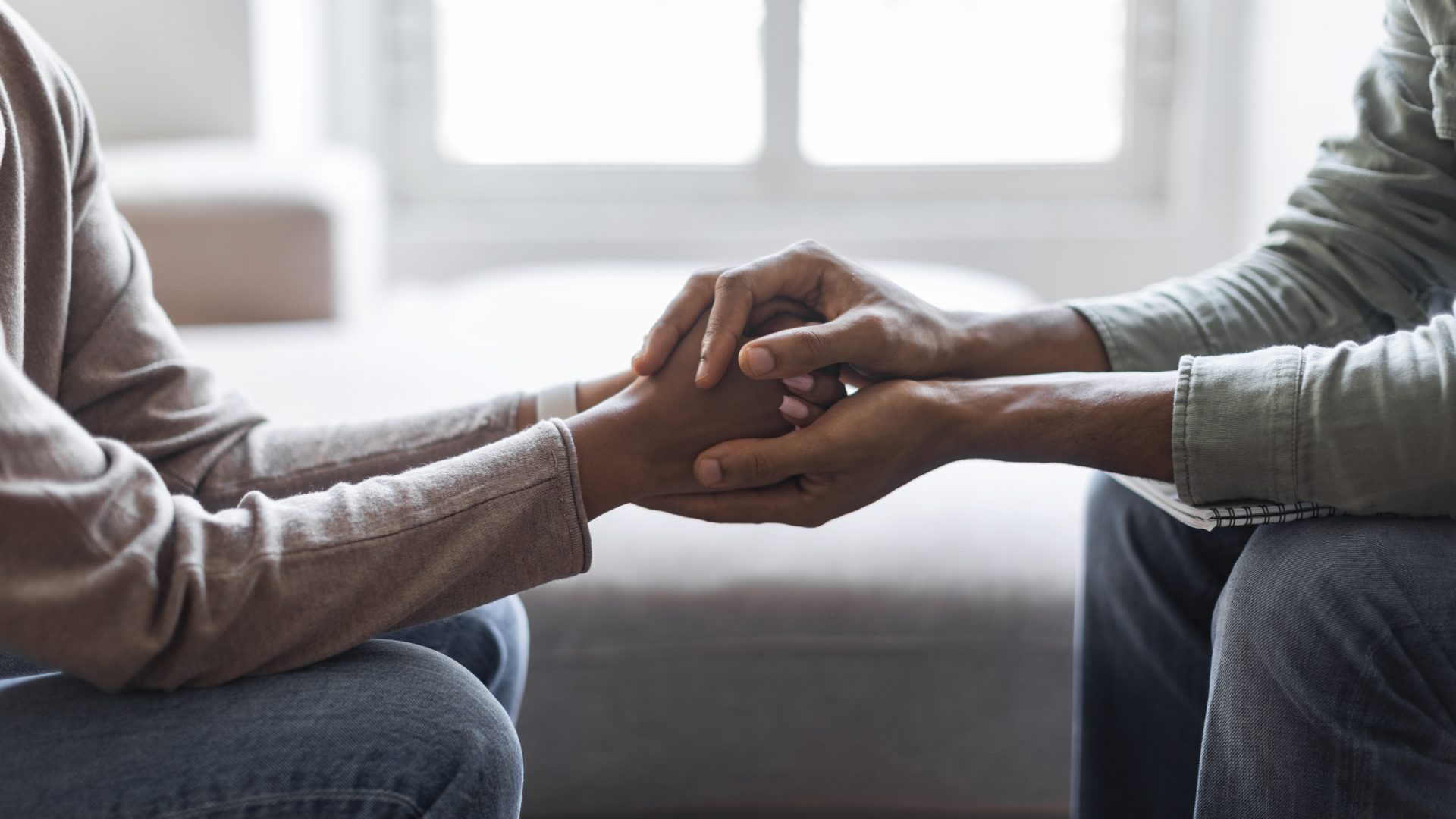 psychologist holding hands of woman patient provid 2023 11 27 05 01 50 utc
