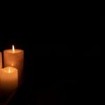 three candles burning at night in dark home 2023 11 27 05 35 35 utc