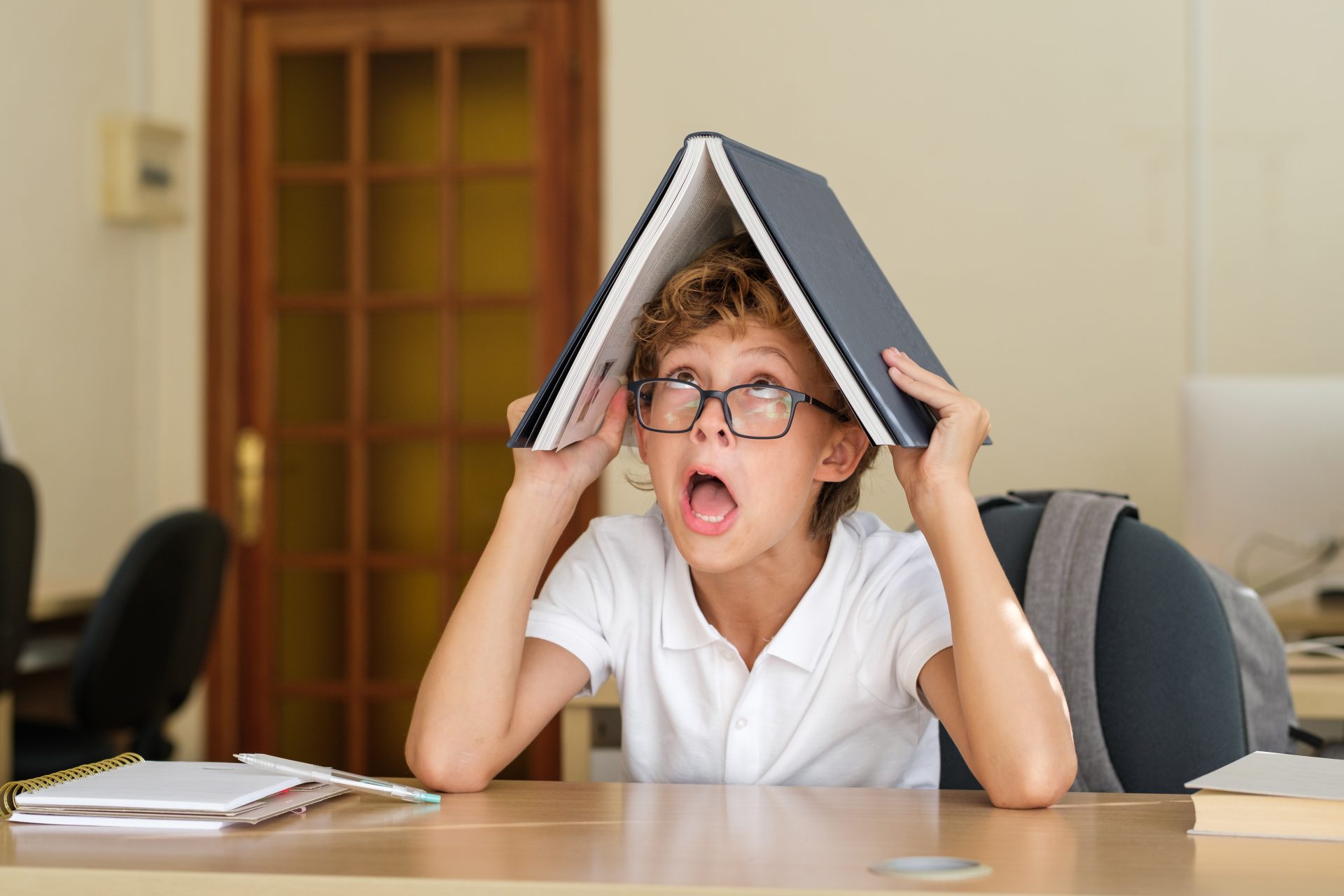 comic schoolboy with book on head 2023 11 27 04 51 06 utc