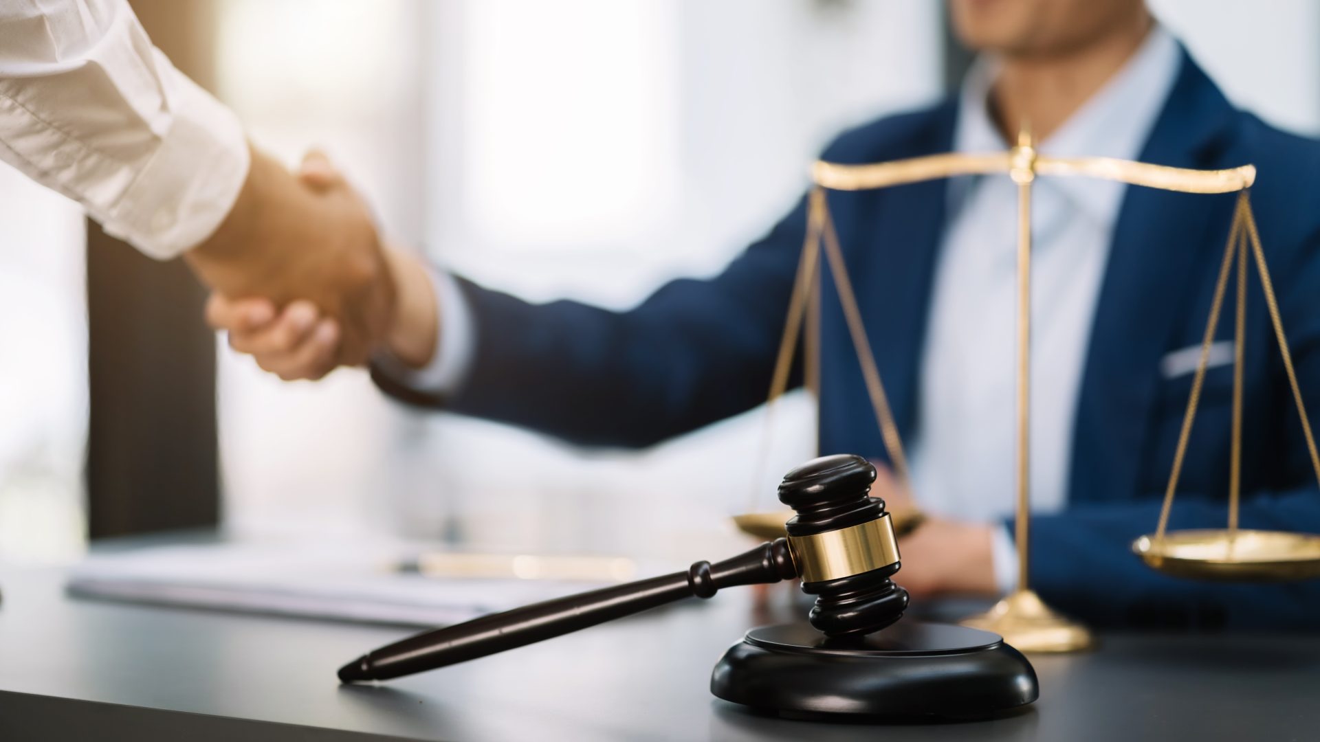 middle age partner lawyers attorneys shaking hands 2023 11 27 05 03 48 utc