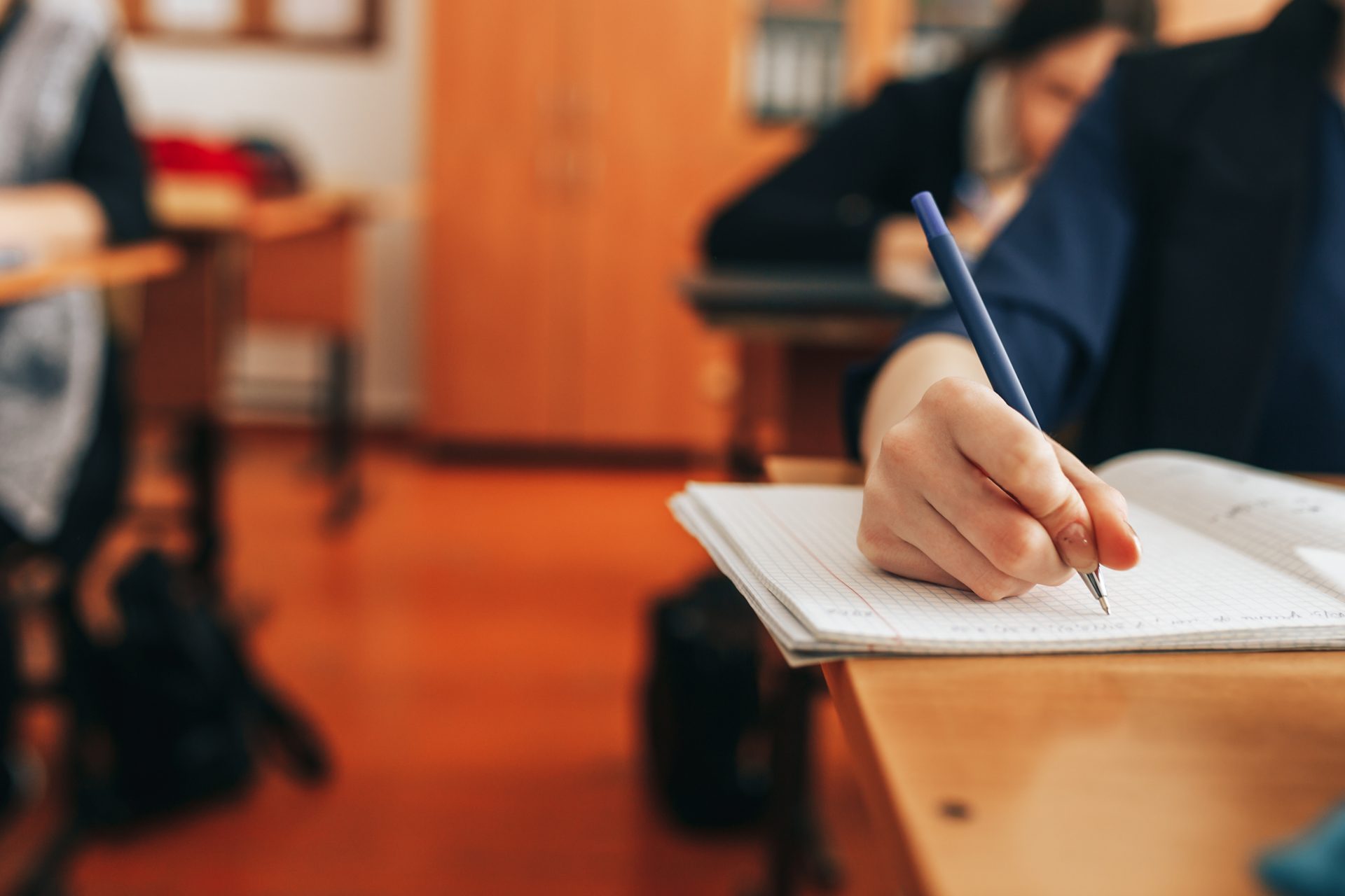 the student writes in a notebook 2023 11 27 04 59 04 utc