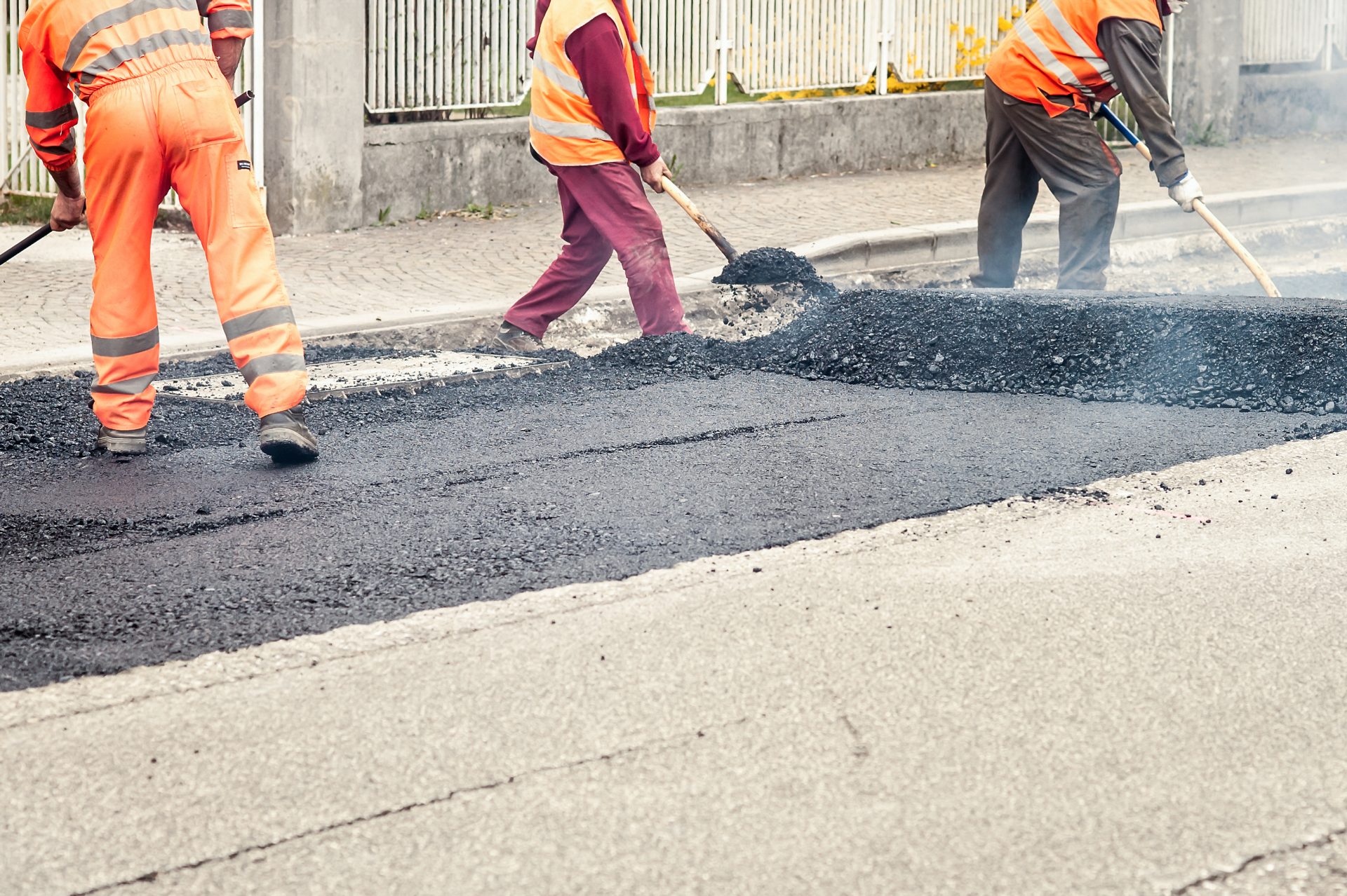 workers on asphalting paver machine during road st 2023 11 27 05 22 16 utc