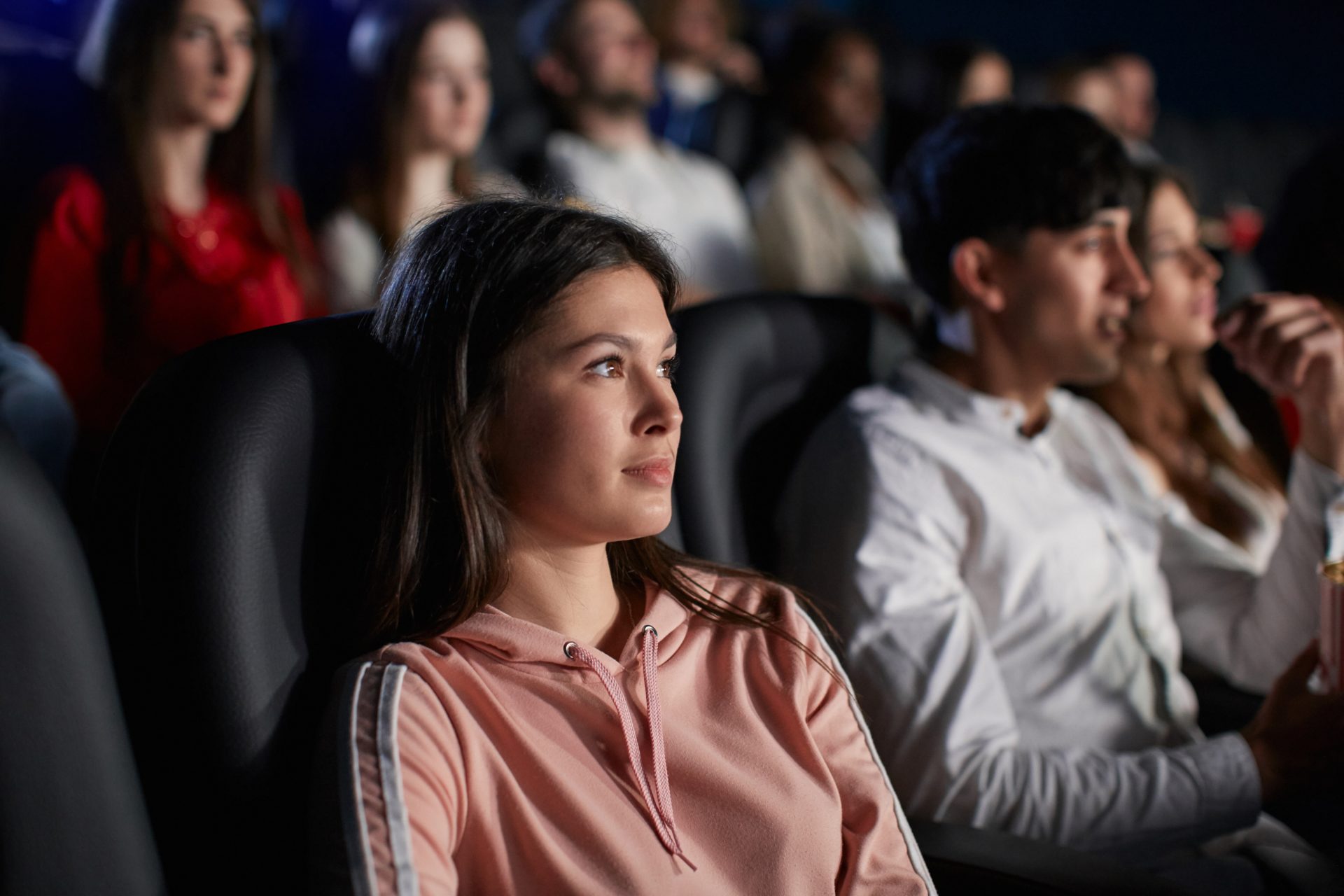 young girl enjoying free time in movie theater 2023 11 27 04 47 02 utc