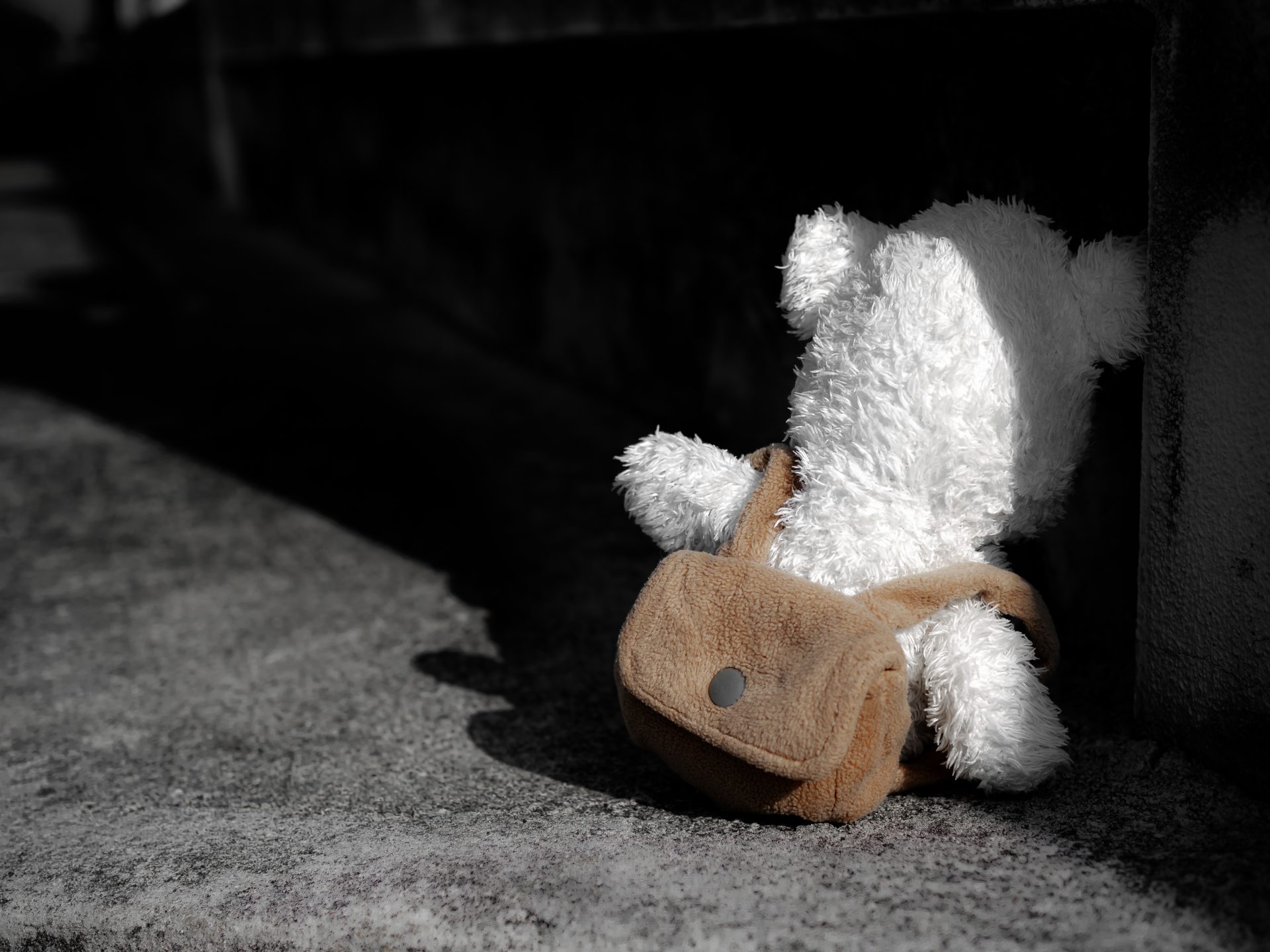 alone teddy bear sitting with dark black wall stre 2023 11 27 05 28 45 utc