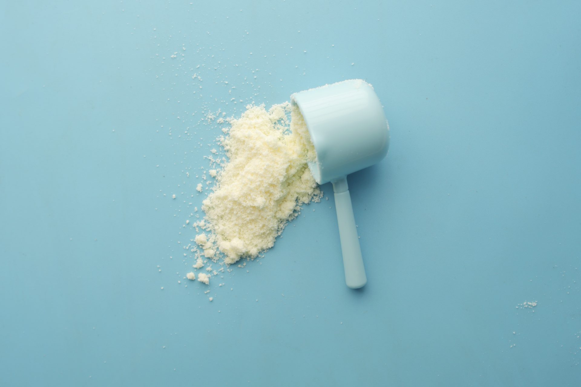 close up of baby milk powder and spoon on tile bac 2023 11 27 05 12 33 utc