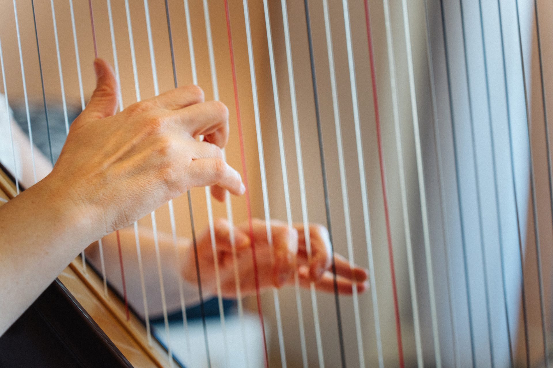 close up of the hands of woman playing harp 2024 03 20 15 50 59 utc