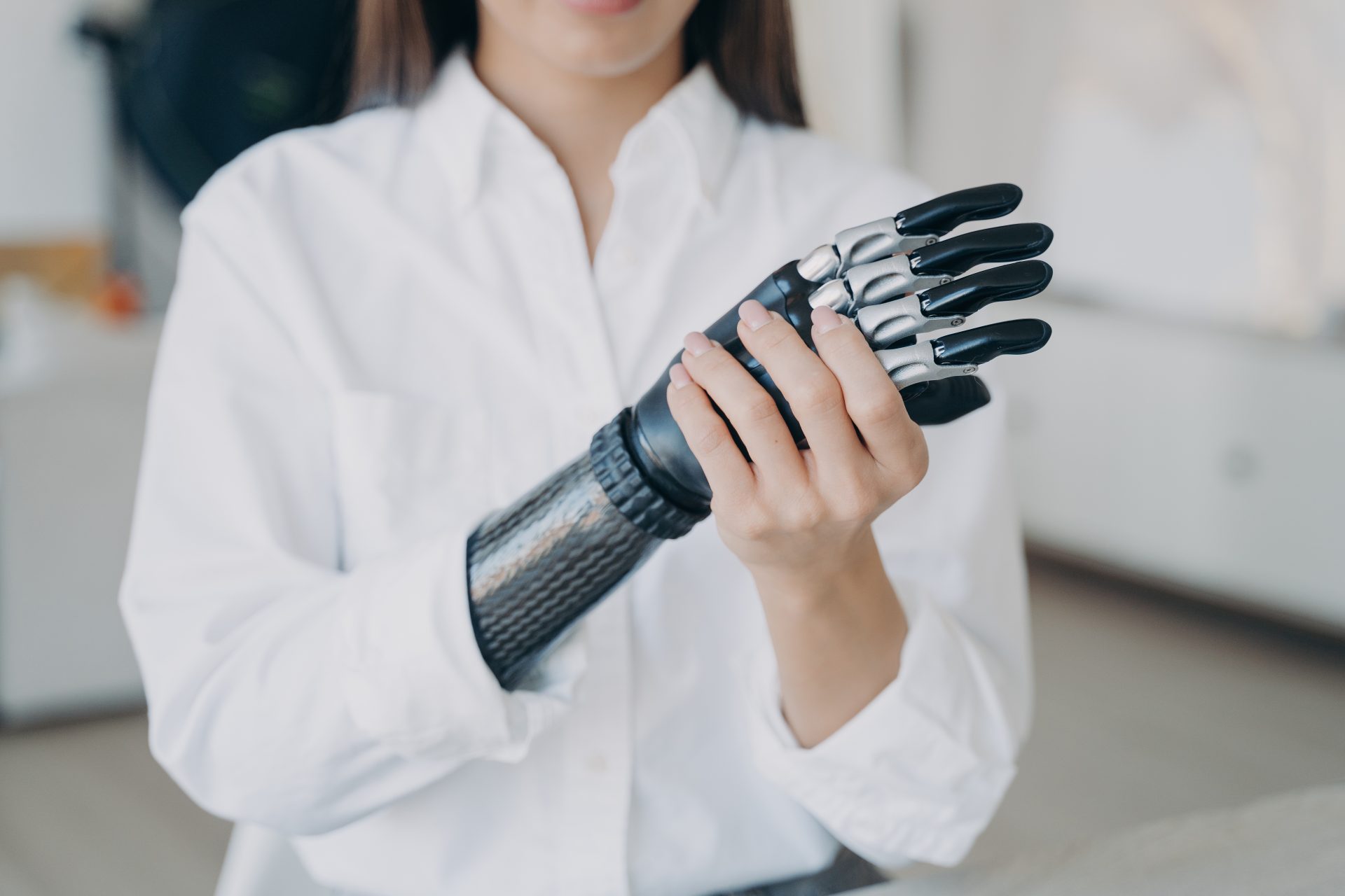 handicapped young woman is assembling bionic arm w 2023 11 27 05 02 17 utc