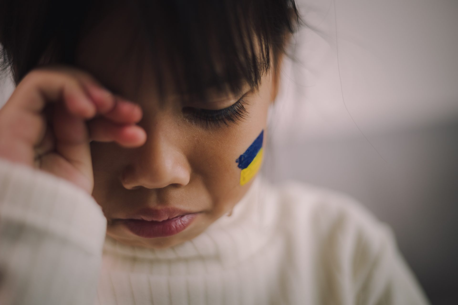 a child with the flag of ukraine is crying sadnes 2023 11 27 04 57 57 utc