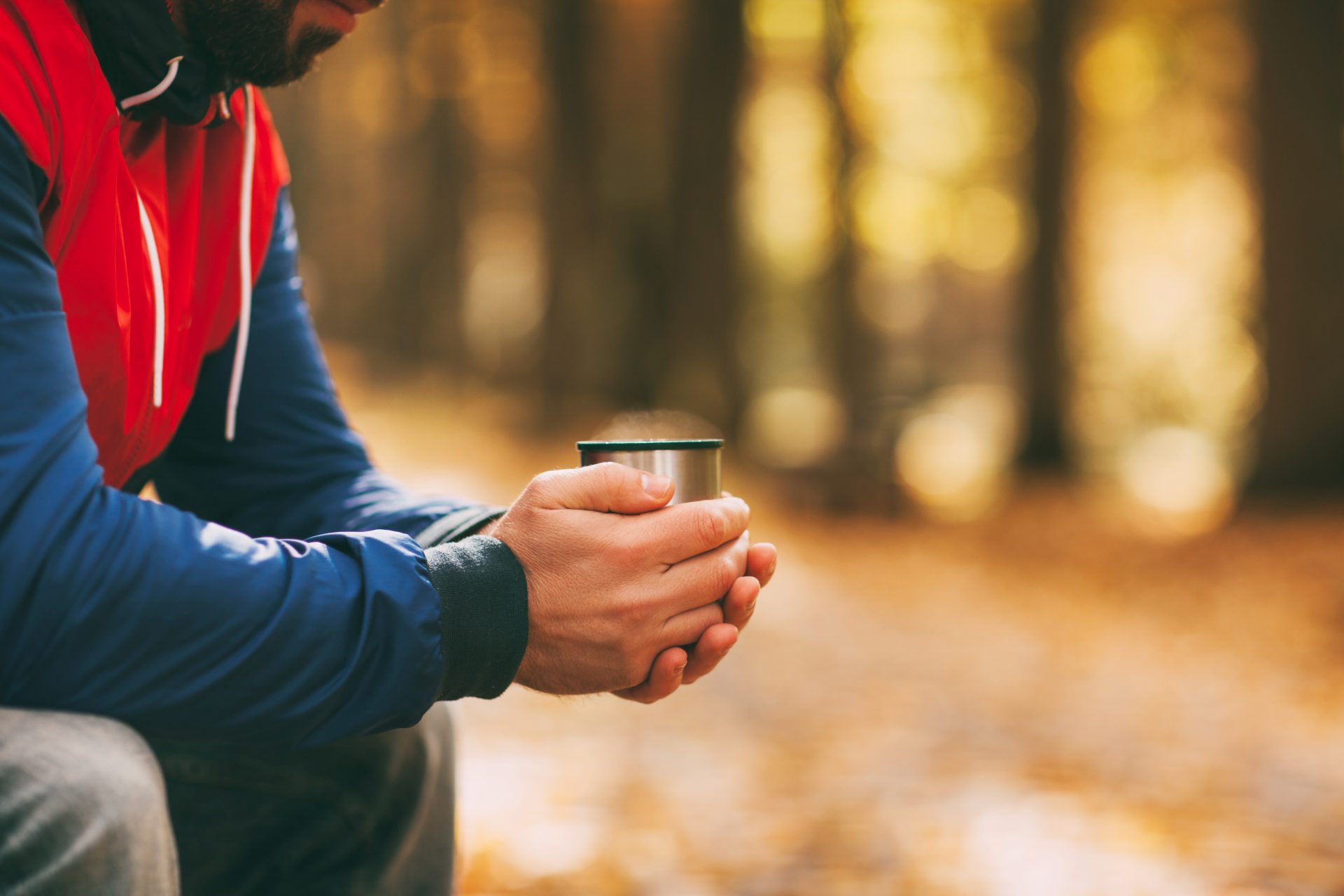 close up of a man s hands with a cup of hot drink 2024 09 18 13 03 18 utc