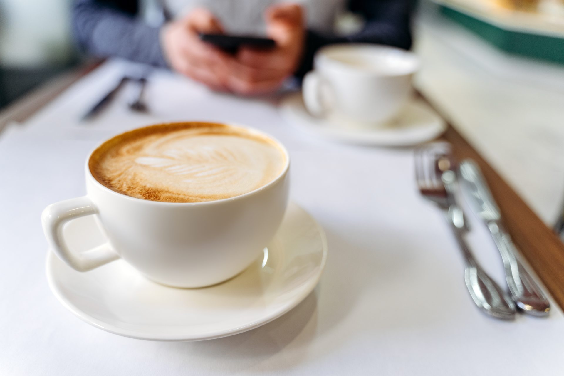 cup with coffee on the table in a coffee shop 2024 10 18 10 40 53 utc