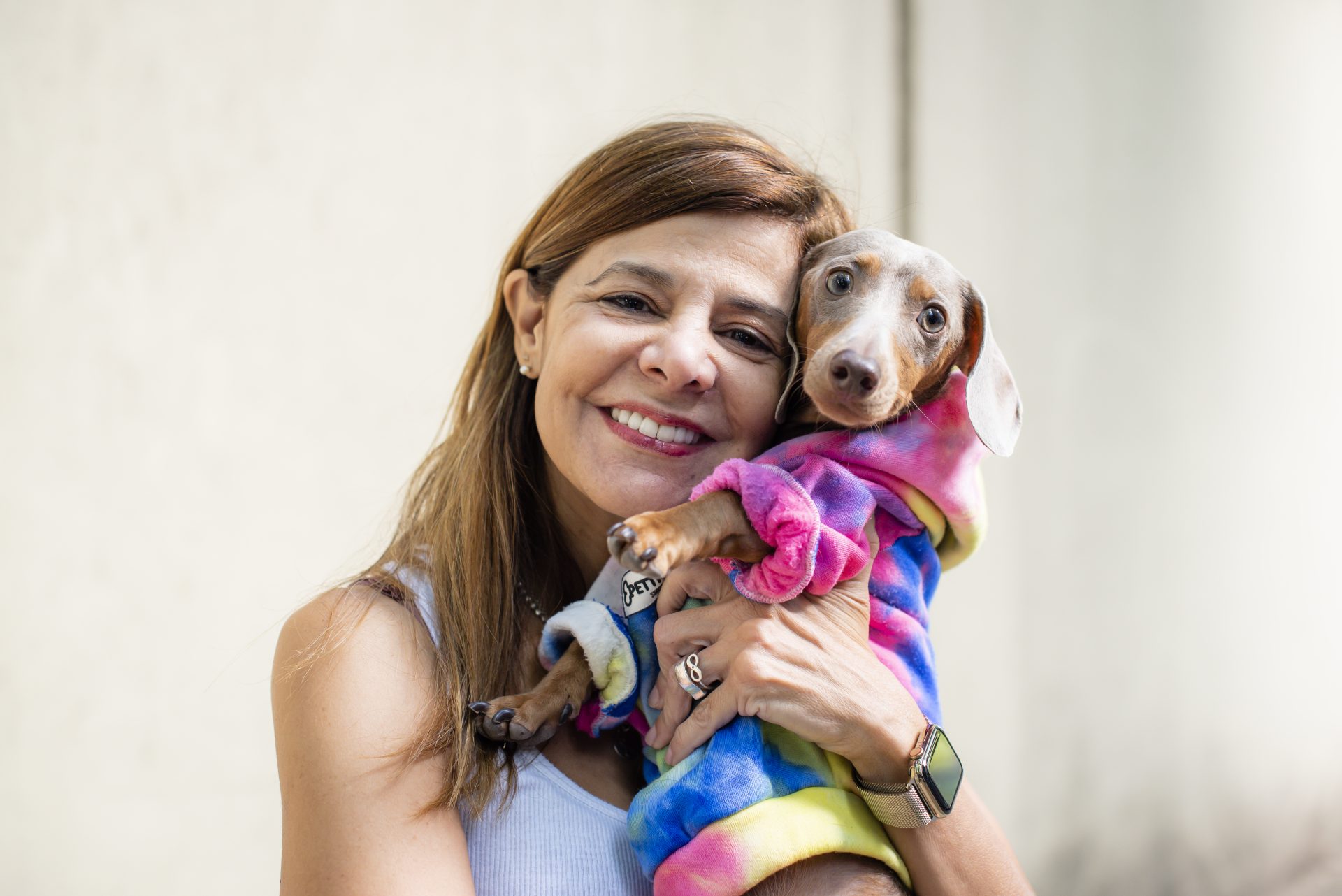 latin woman holding her dog 2023 11 27 05 30 38 utc
