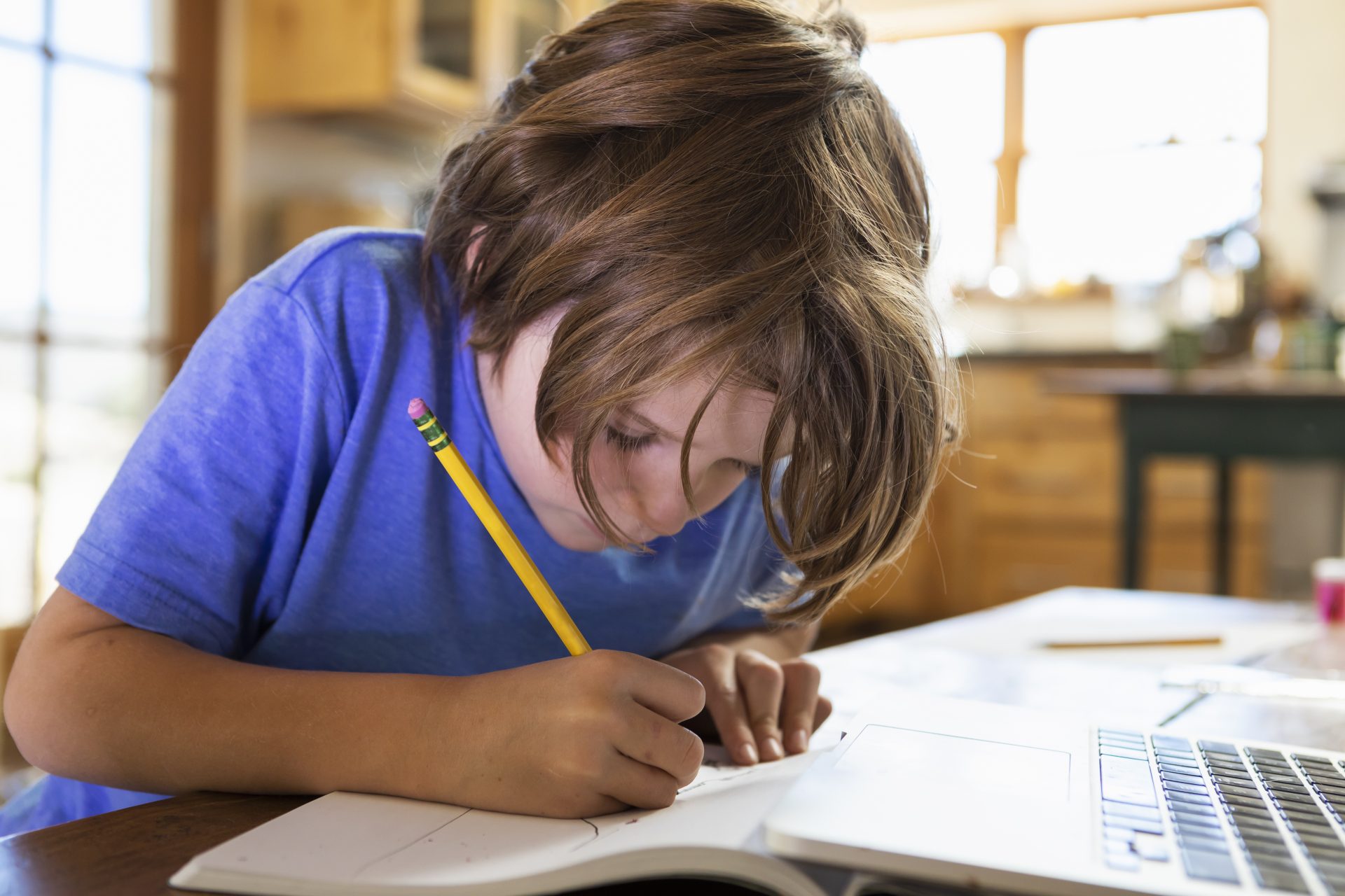 young boy at home writing and drawing in his drawi 2023 11 27 05 21 45 utc