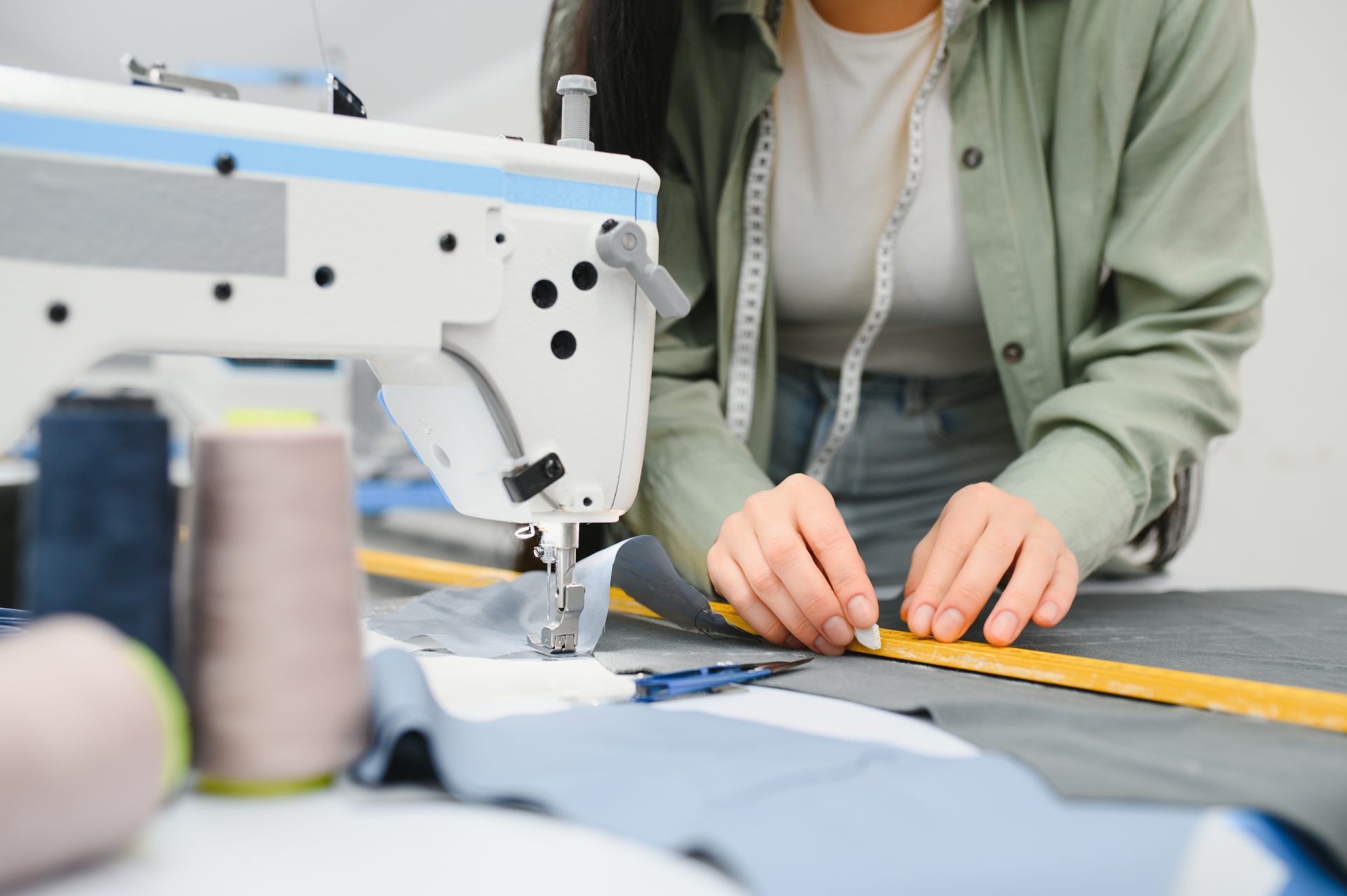 young dressmaker woman sews clothes on working tab 2024 02 14 19 14 03 utc