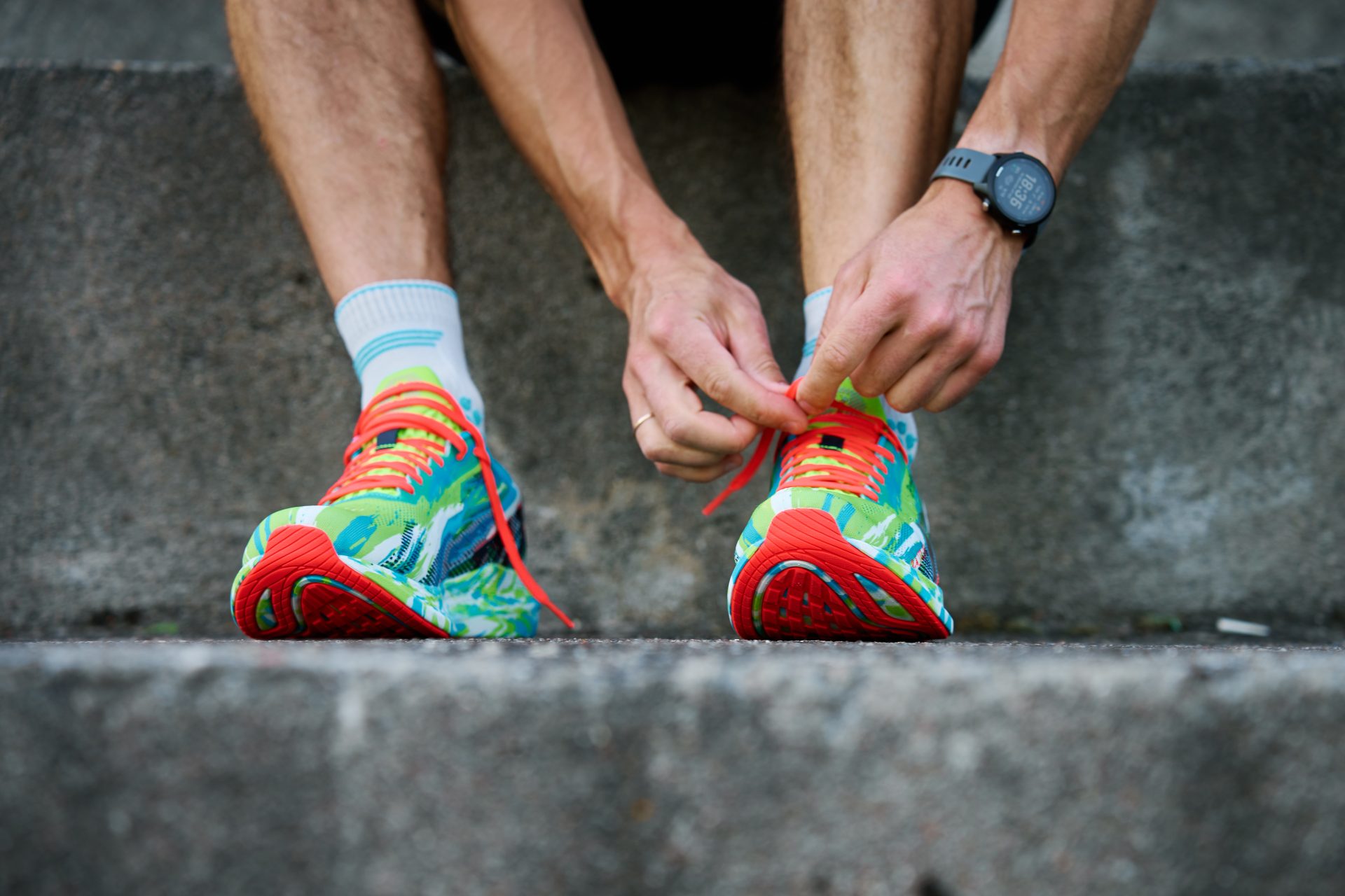 athletic man tying his running shoes before exerci 2023 11 27 05 10 35 utc