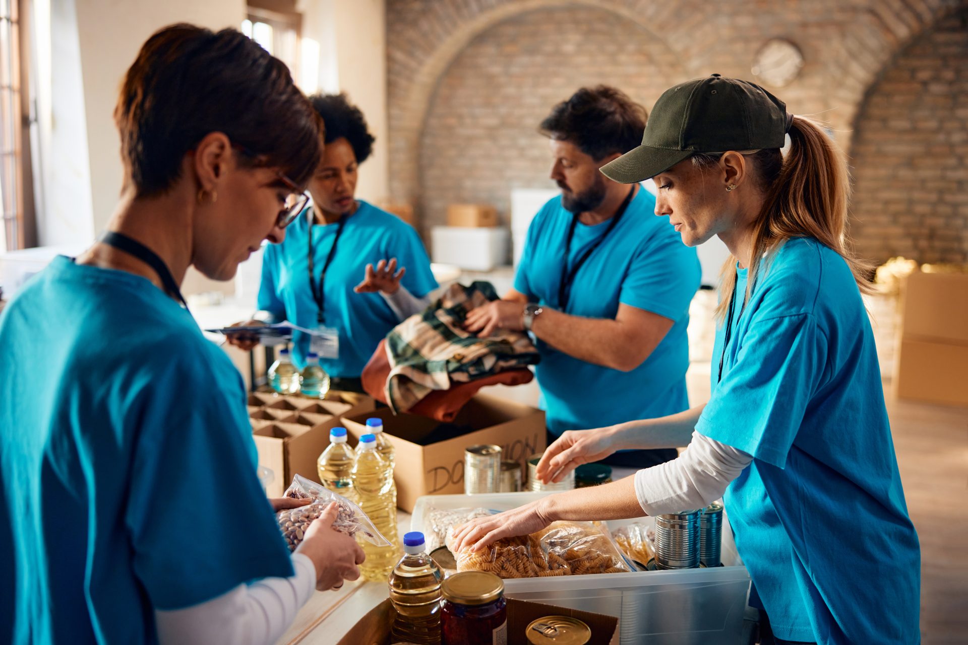 diverse group of people sorting donated food for t 2024 12 13 21 38 53 utc