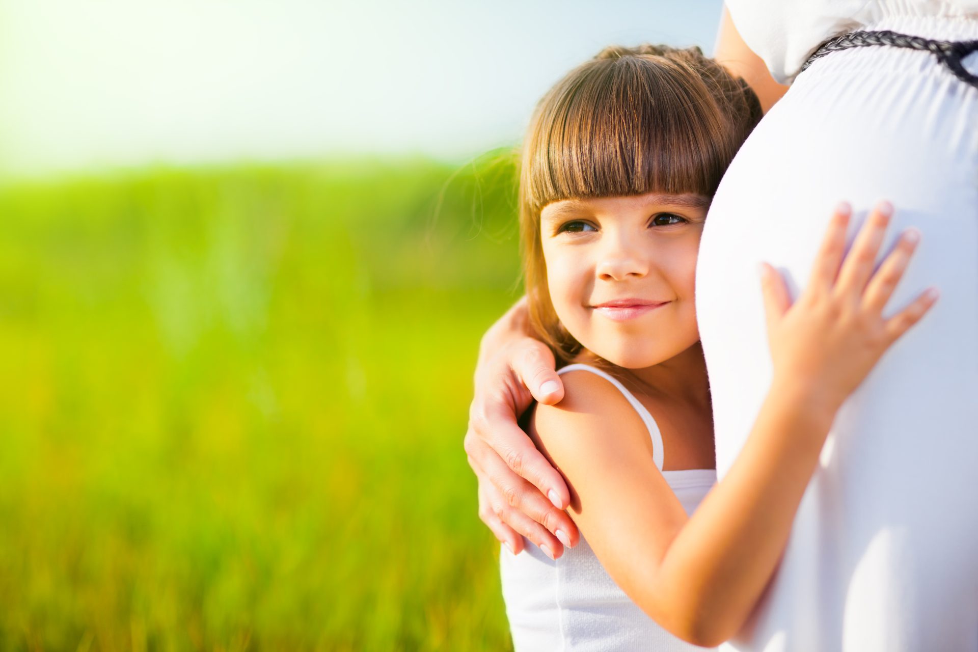 little girl hugs mom pregnant belly 2025 01 29 05 11 24 utc