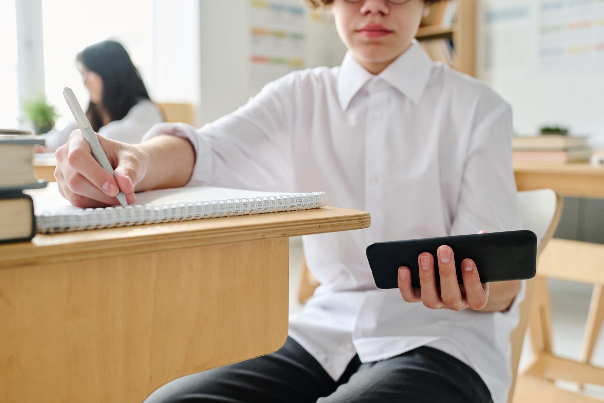 student writing off the phone in class 2023 11 27 05 25 24 utc