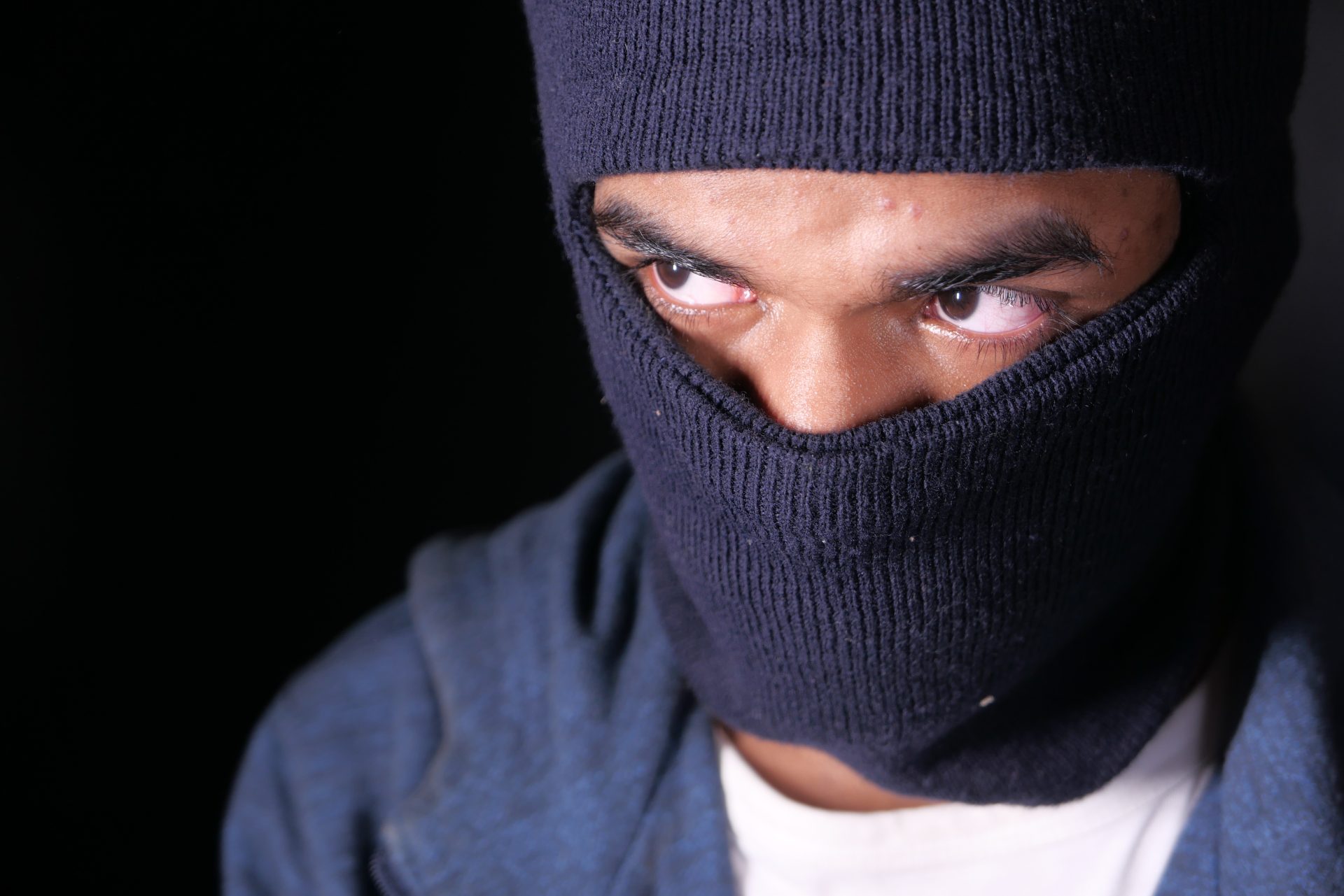thief in a mask on black background close up 2024 12 12 05 34 18 utc