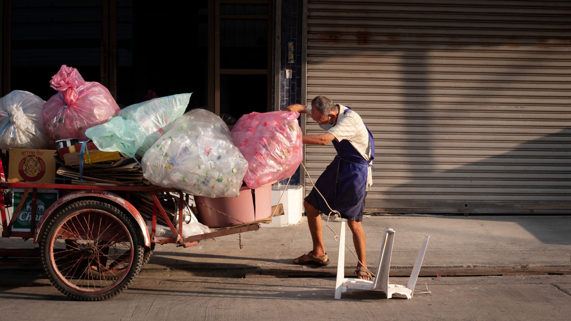 asian elderly junk buyer carrying recycling waste 2023 11 27 05 27 38 utc