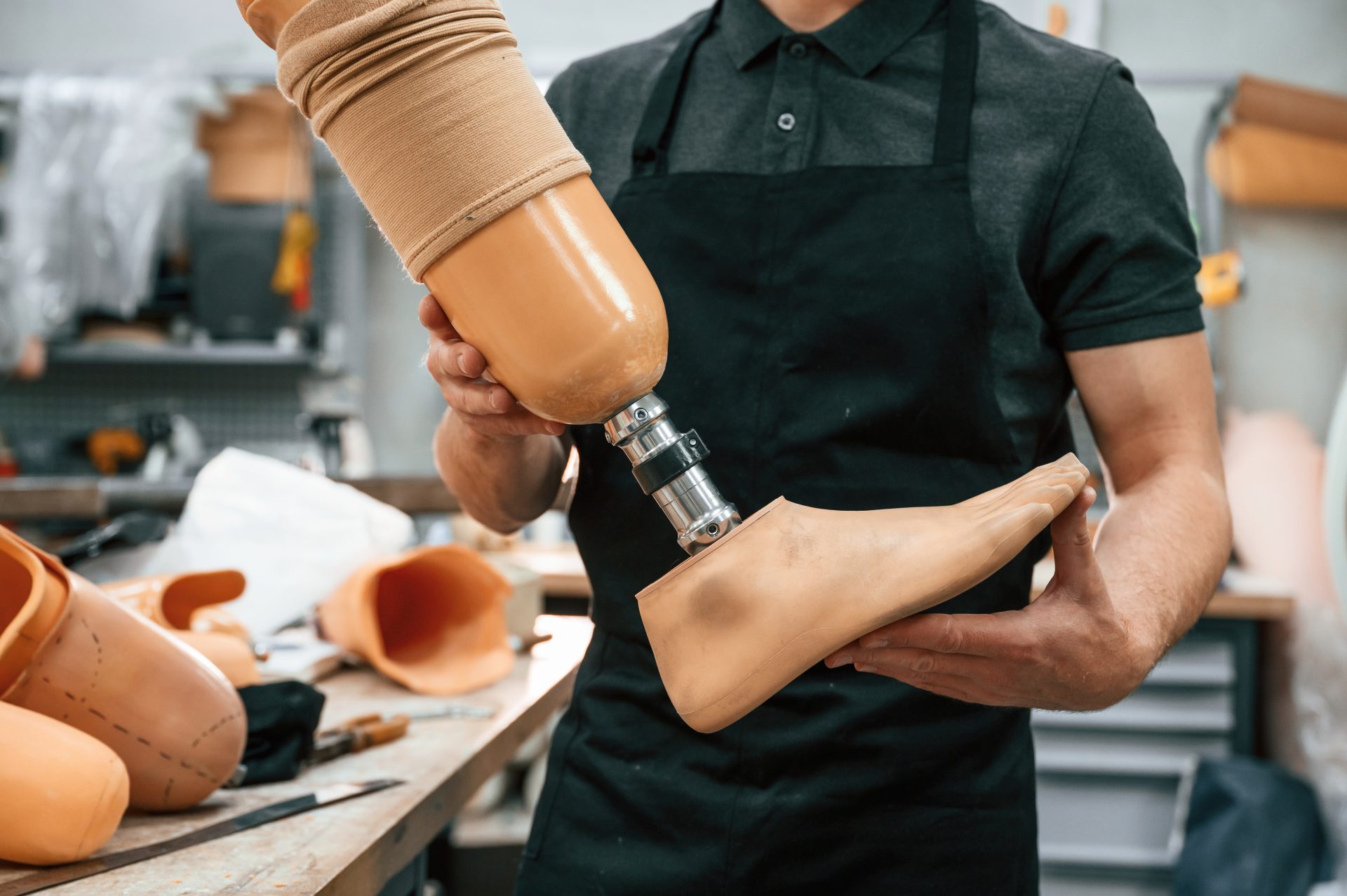 close up view technician holding prosthesis in ha 2025 03 18 19 42 42 utc
